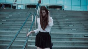 model walking down stairs