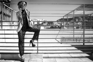 female model posing outside black and white