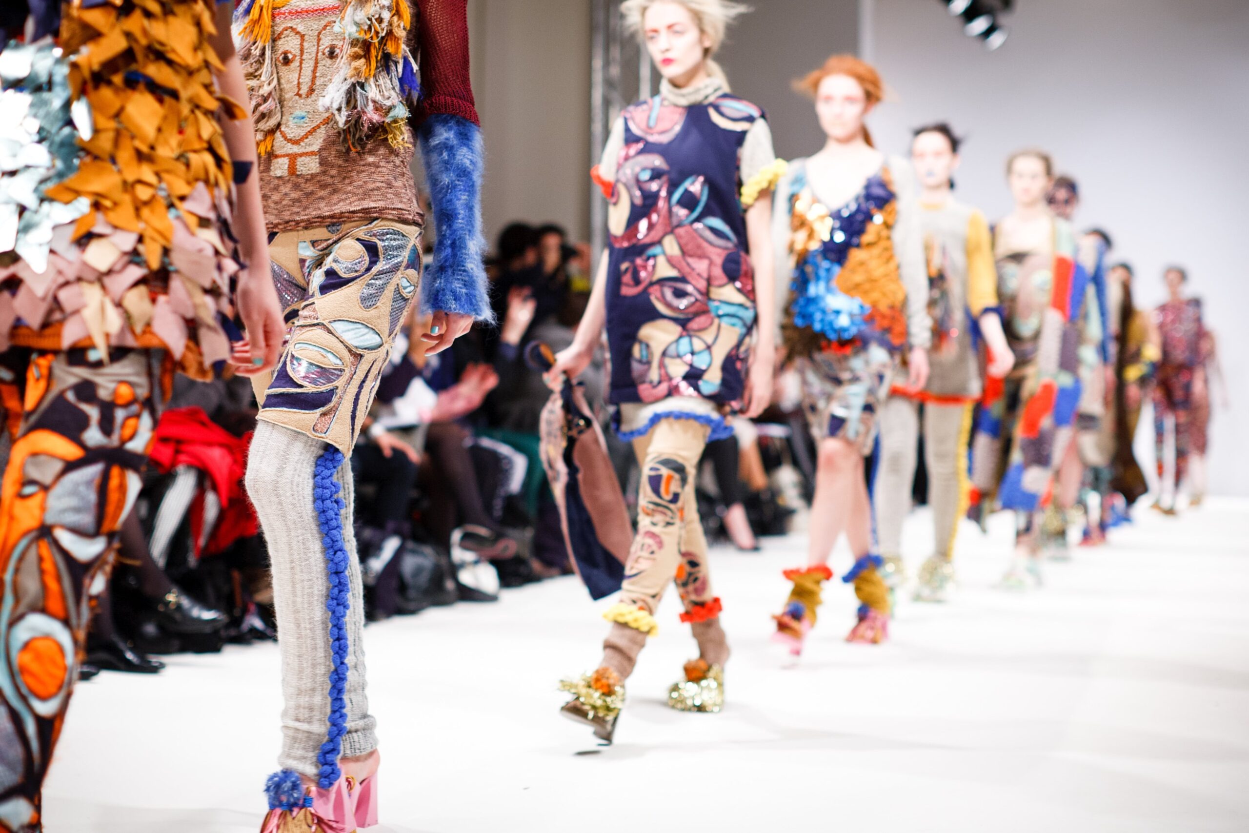 fashion models walking down a runway